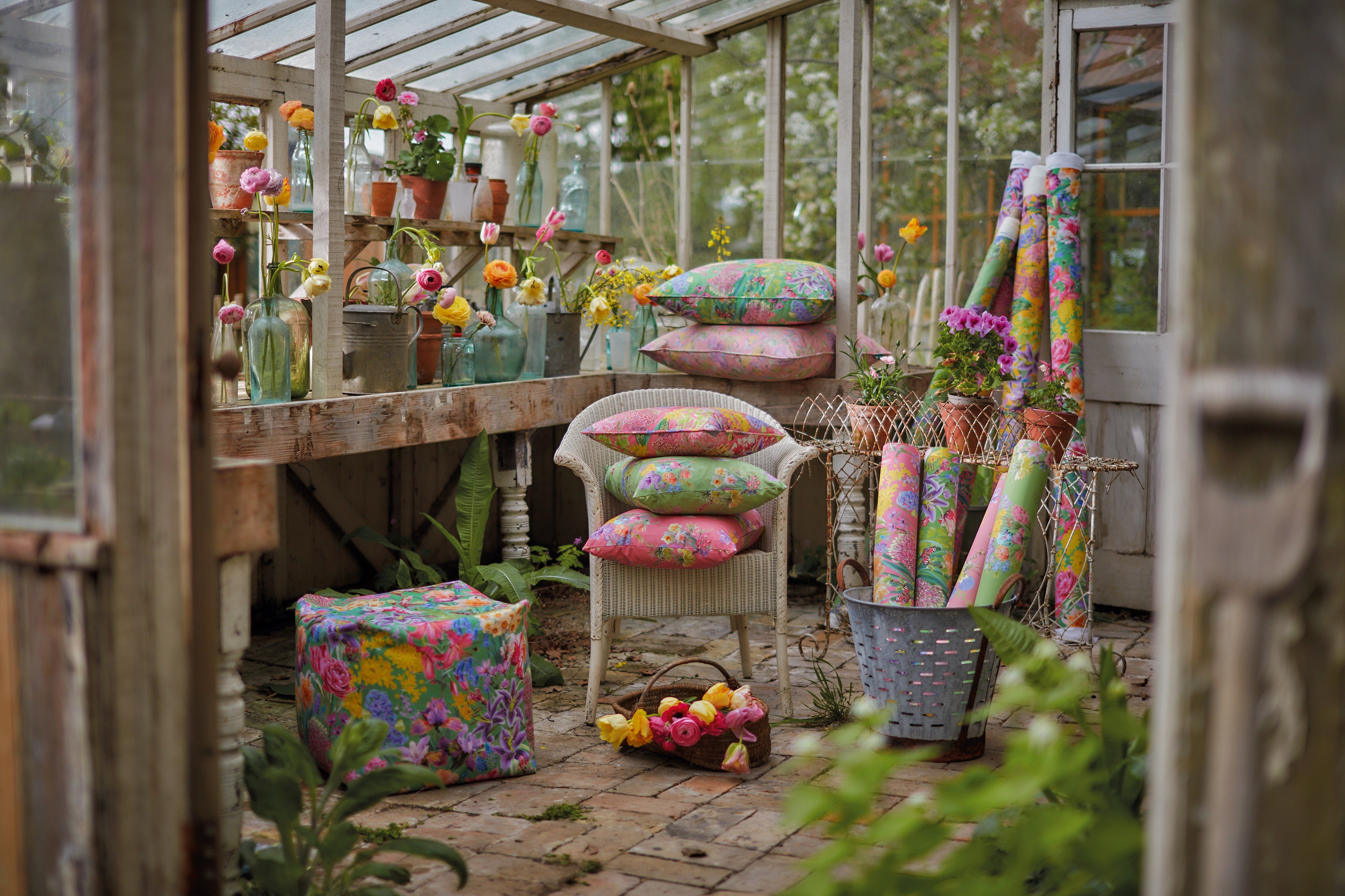 nature inspired glasshouse filled with colourful botanical floral patterns in sustainable fabrics, wallpaper and cushions.
