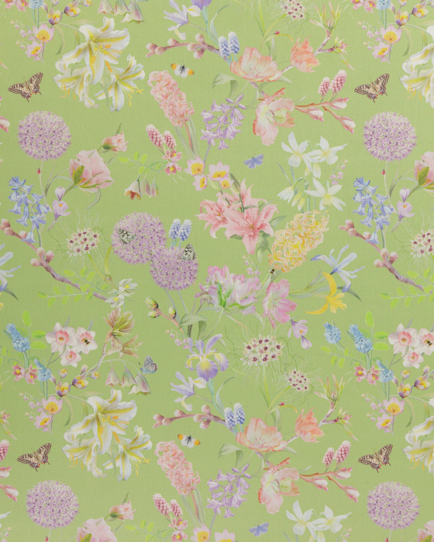 Hopeful Beginnings fabric in green featuring hand drawn English garden flowers including daffodils, Lillies and iris on a soft green background.