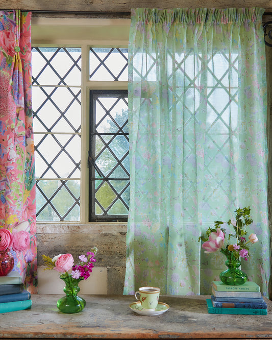 100% organic cotton voile fabric with a delicate hopeful beginnings floral design in green