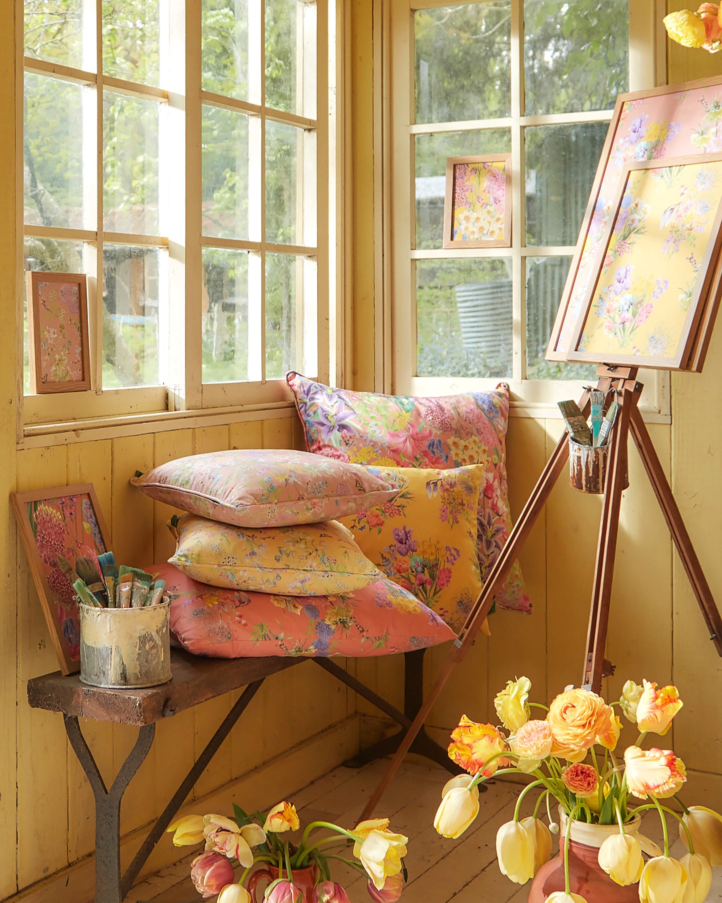 artists studio filled with wallpaper and cushions in luxury sustainable floral patterned fabrics