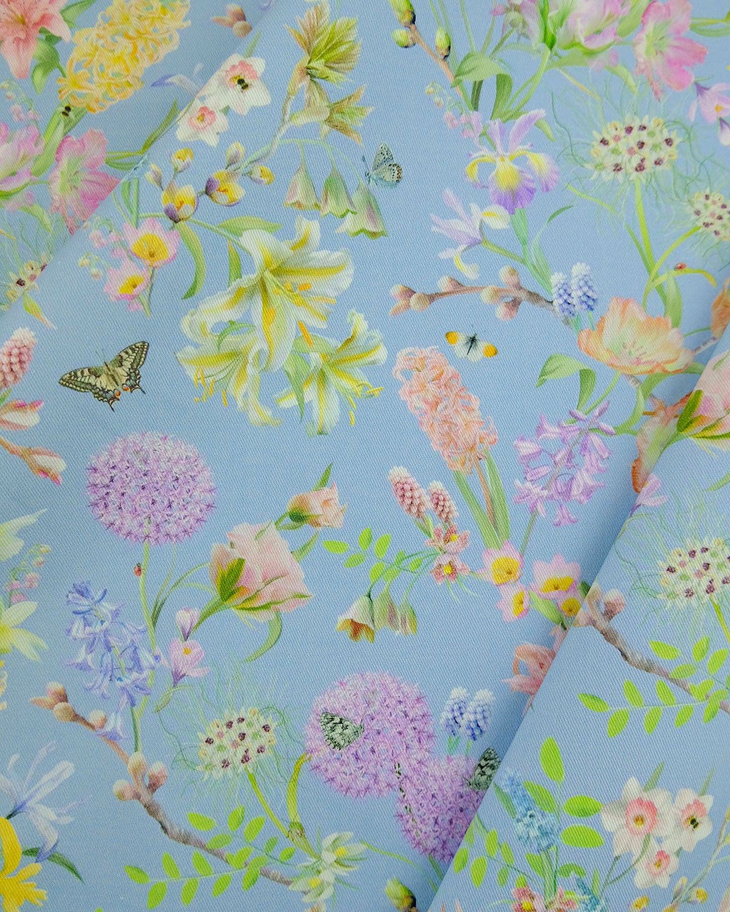 Sustainable organic cotton fabric in an exclusive nature inspired sky blue for window curtains and bespoke pillows.