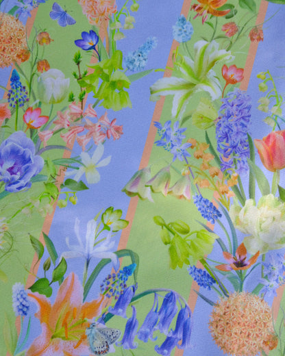 Colourful floral pattern with various flowers and leaves on a blue and green striped background