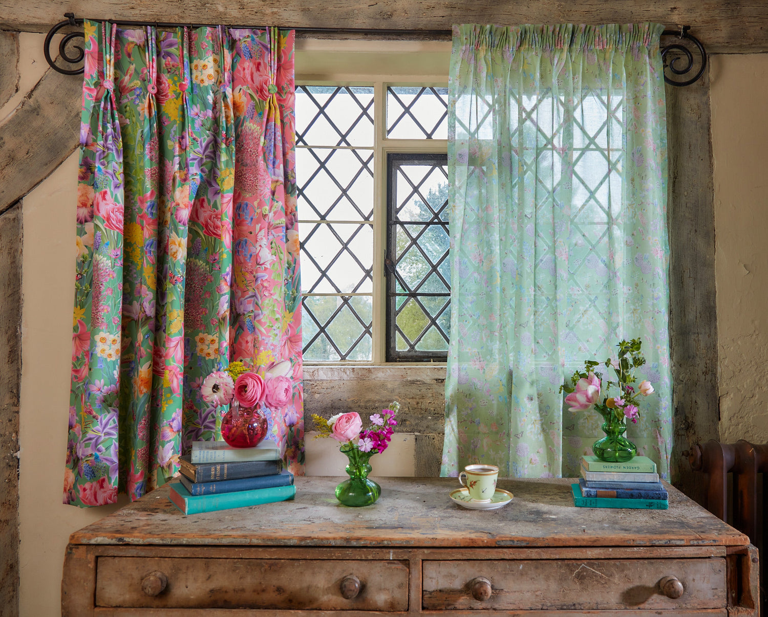 Burst Into Bloom floral curtains and sheer voile styled in a traditional cottage window with botanical accessories and fresh flowers.