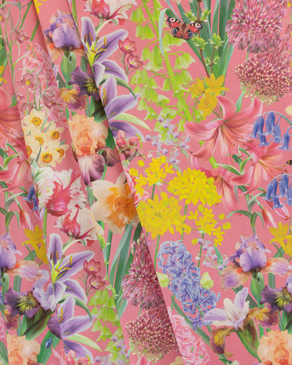 Burst Into Bloom Pink botanical floral fabric featuring hand painted crocus, alliums and summer flowers in plum, yellow and blue on a hot magenta background.