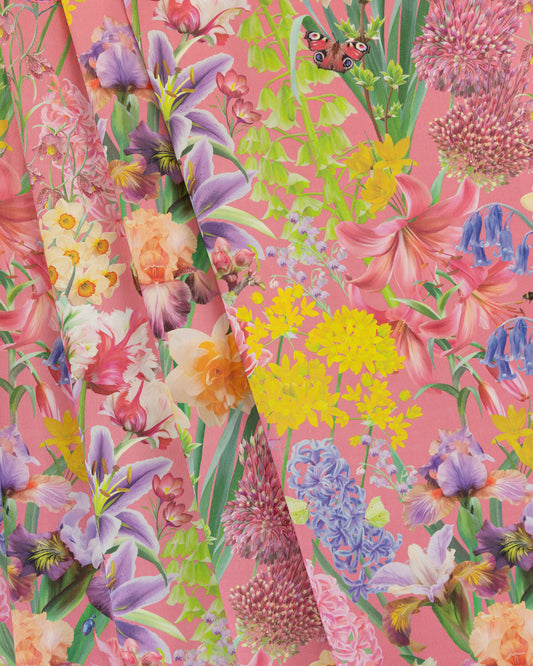 Burst Into Bloom Pink botanical floral fabric featuring hand painted crocus, alliums and summer flowers in plum, yellow and blue on a hot magenta background.