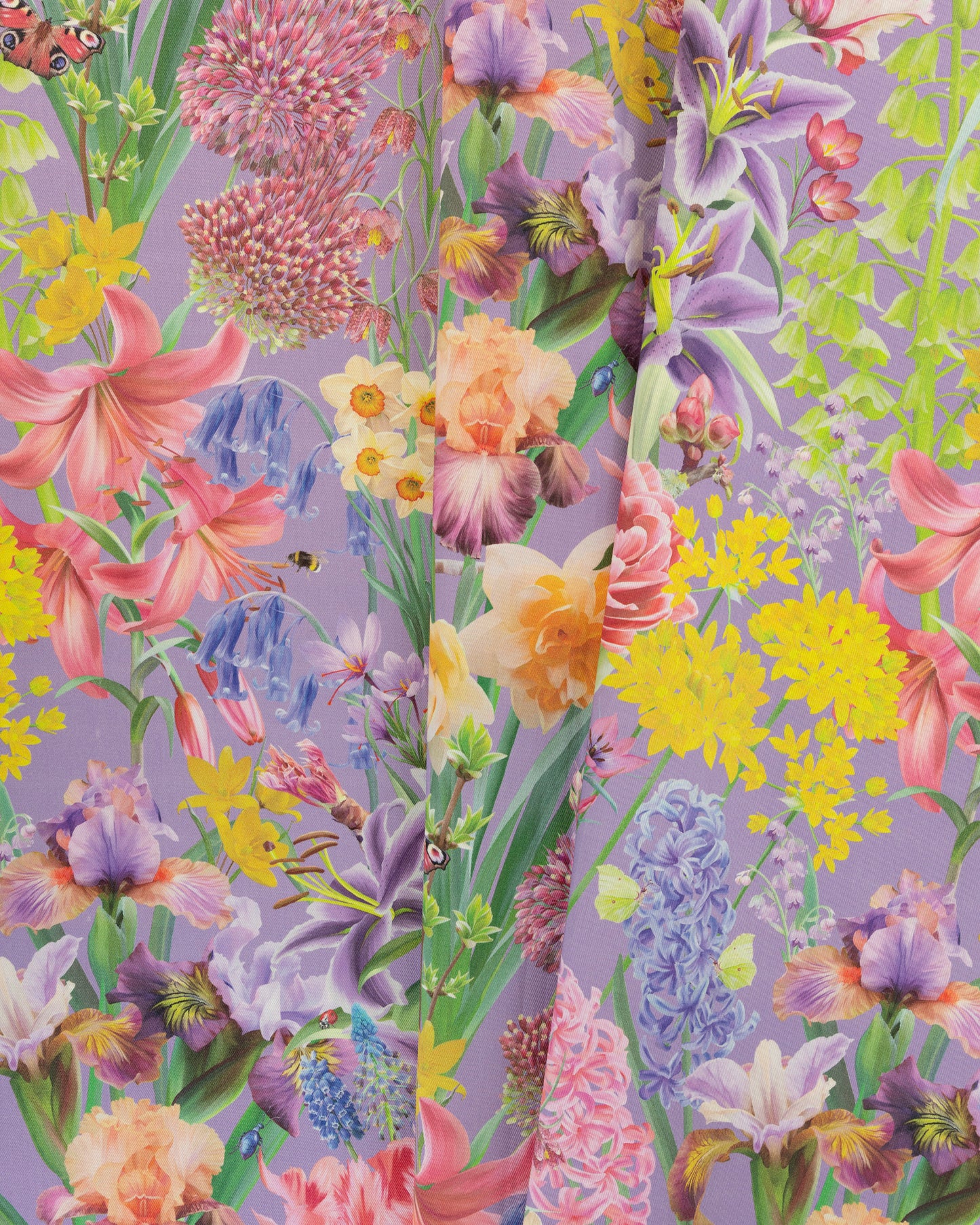 Burst Into Bloom Purple botanical floral fabric featuring hand painted irises, lilies and summer flowers in lavender, fuchsia and gold on a bold amethyst background.