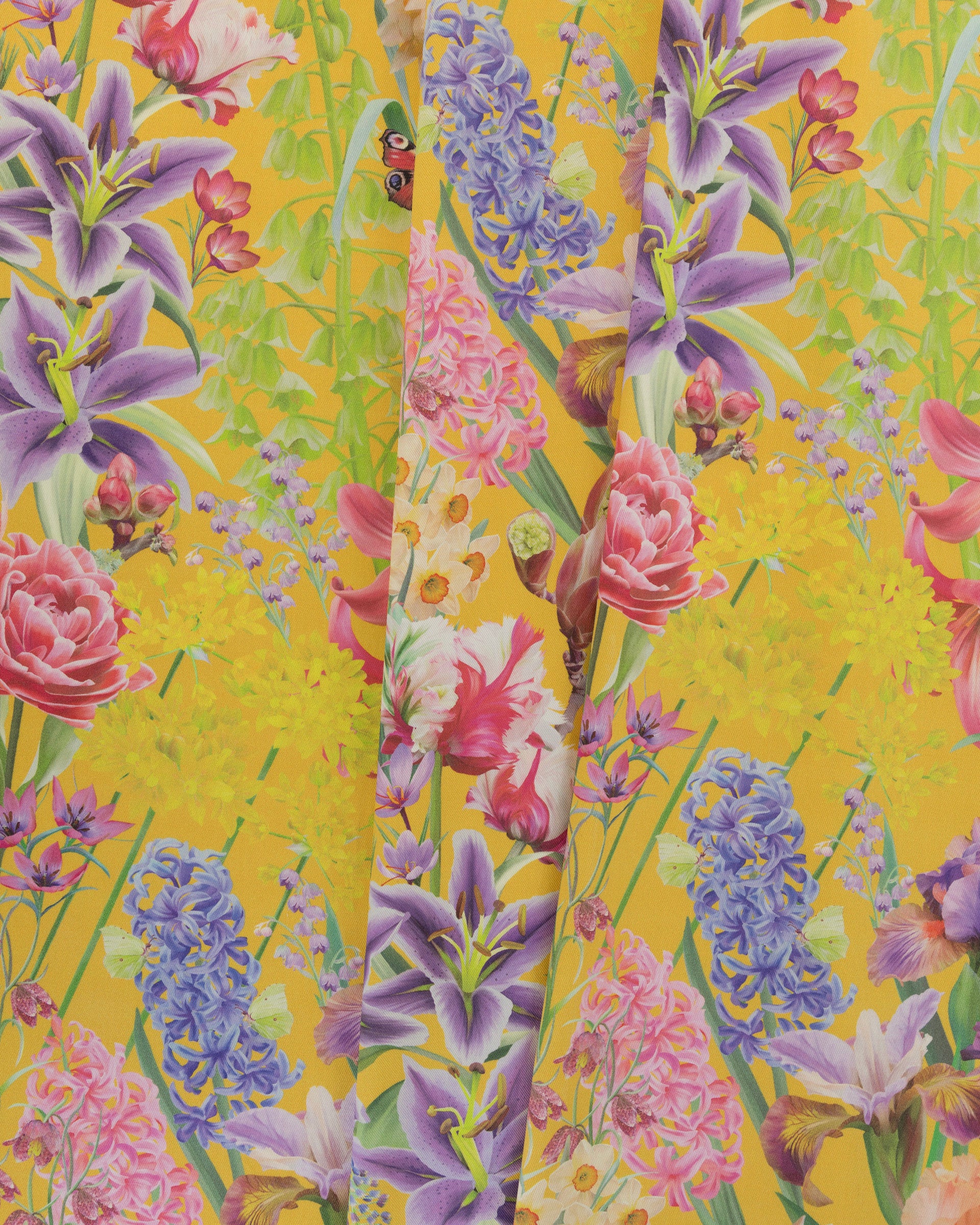 Burst Into Bloom Yellow botanical floral fabric featuring hand painted hyacinths, tulips and summer flowers in lavender, fuchsia and gold on a golden mustard background.