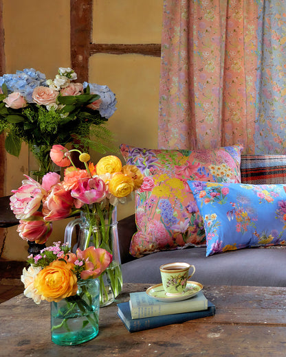 An English cottage style home with inspiring floral luxury cushions in blue and peach