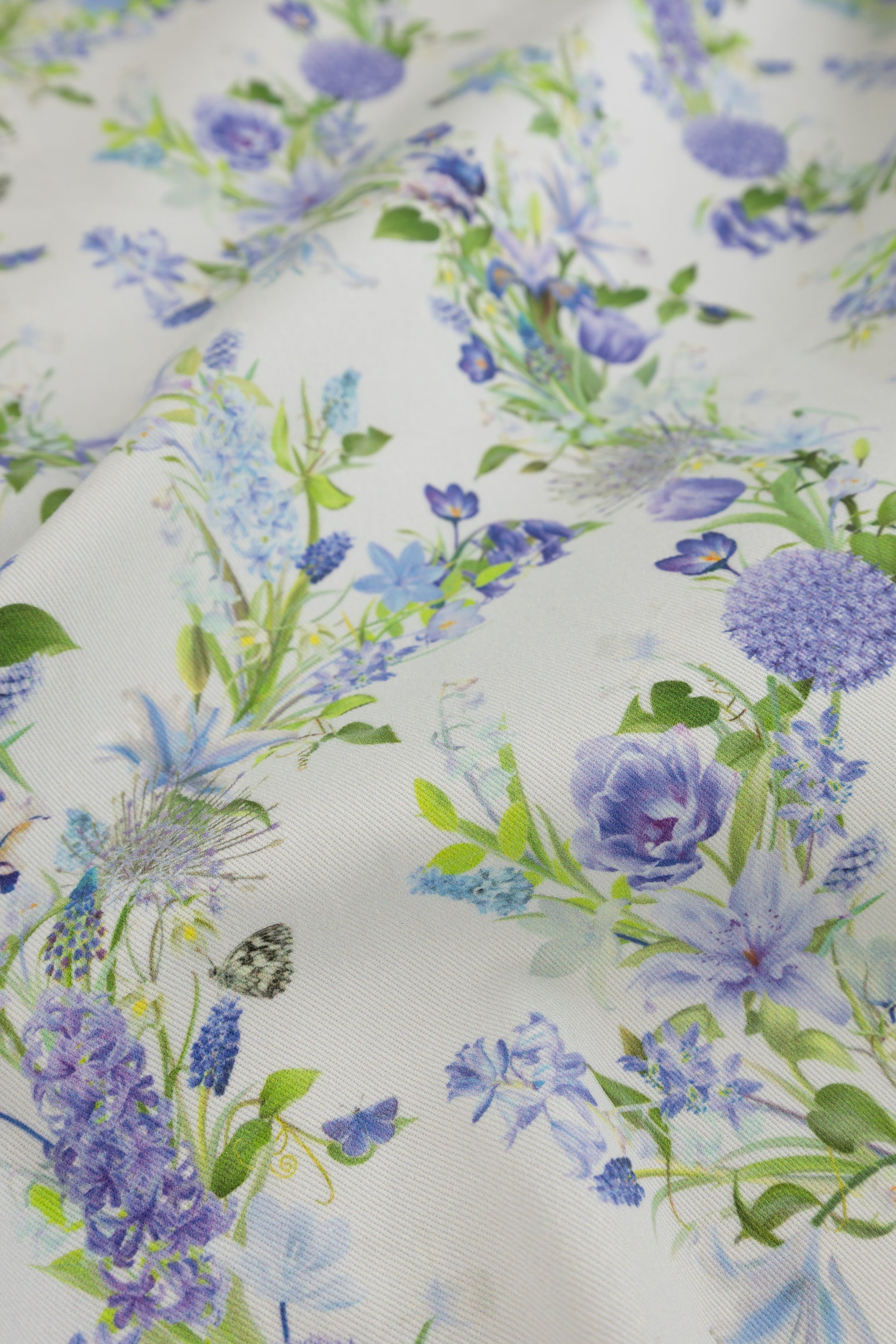 Eternal Drift Glacial Mist blue organic cotton gabardine floral fabric close up showing woven texture detail