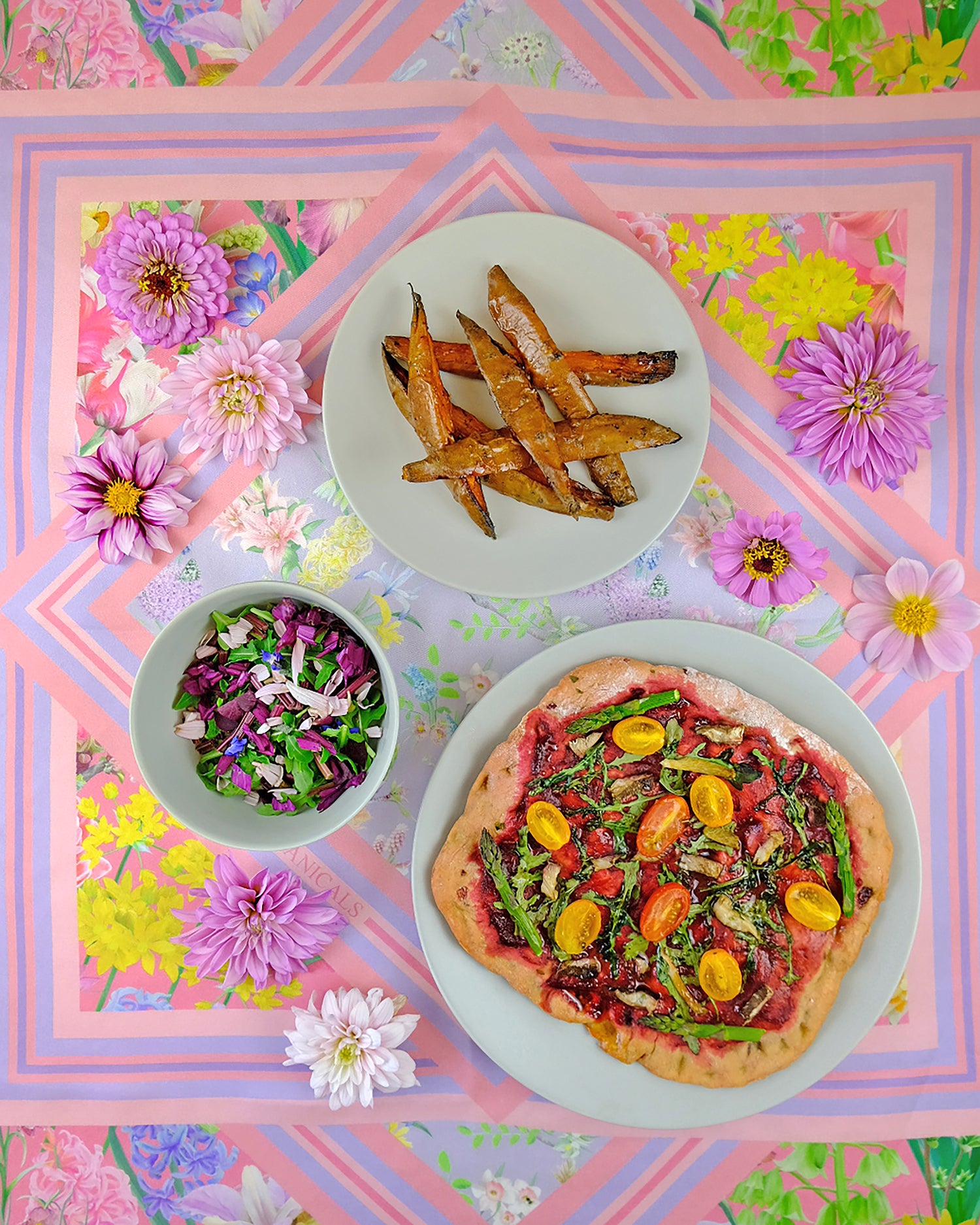healthy colourful and vegan meal inspiration using beetroot and edible flowers for pizza