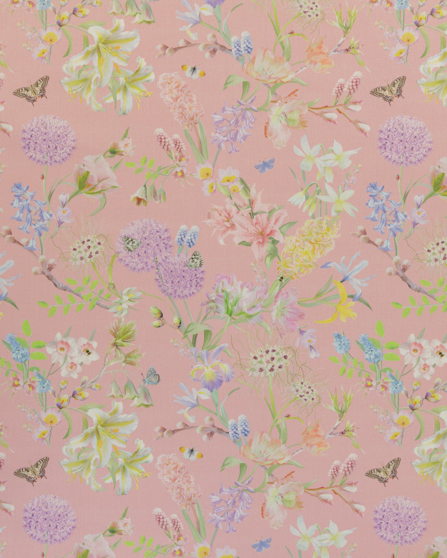 Hopeful Beginnings fabric in pink featuring hand drawn English garden flowers including daffodils, tulips and crocus on a soft pink background.