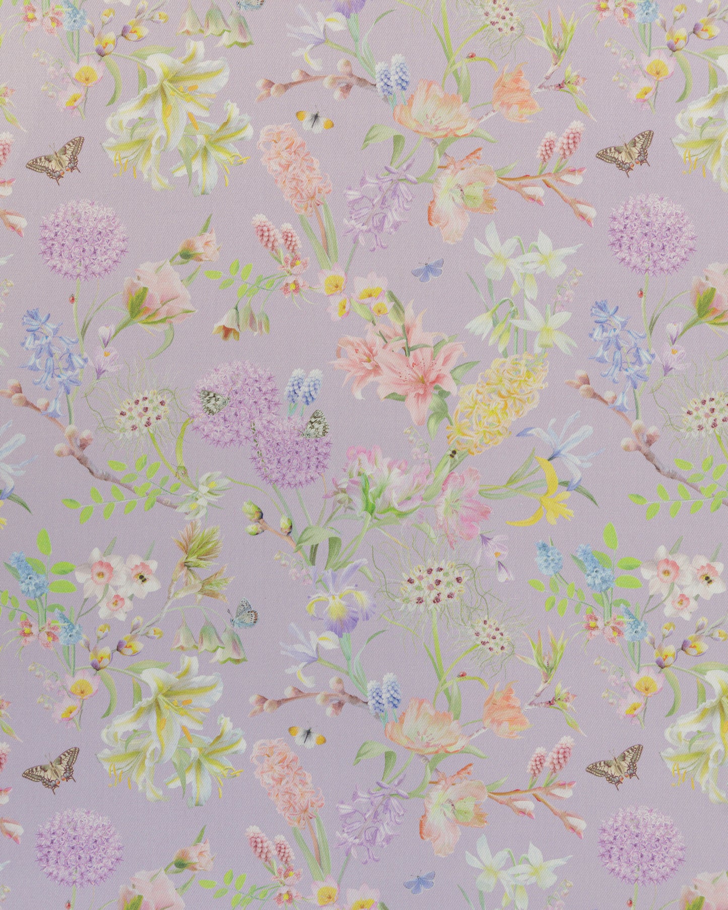 Hopeful Beginnings fabric in light purple featuring hand drawn English garden flowers including hyacinths, Lillies and alliums on a soft lavender background.