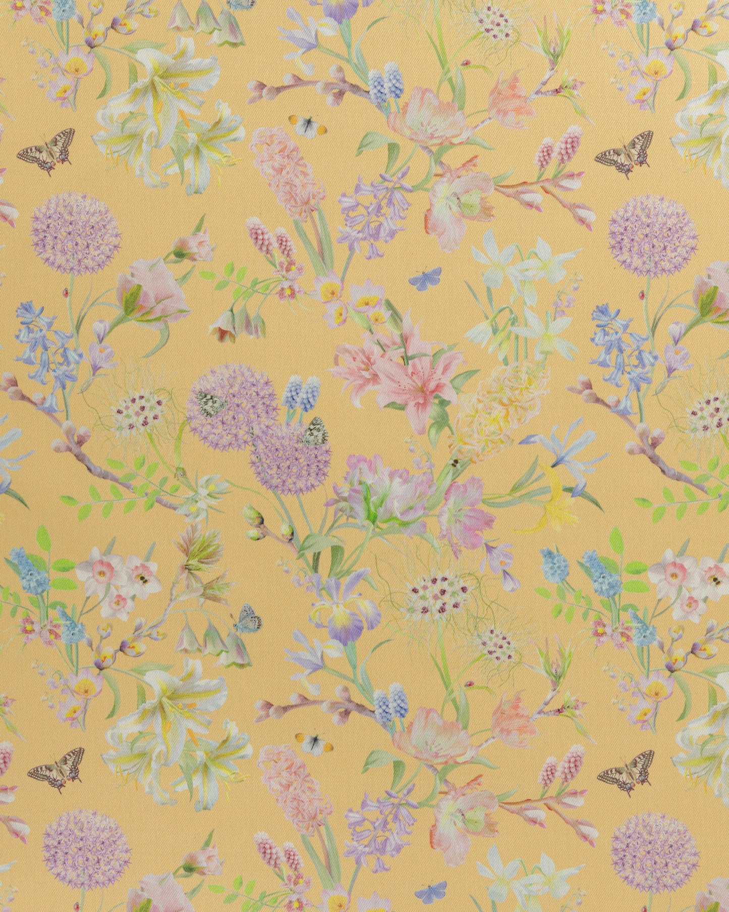 Hopeful Beginnings fabric in yellow featuring hand drawn English garden flowers including daffodils, Lillies and bluebells on a soft lemon background.