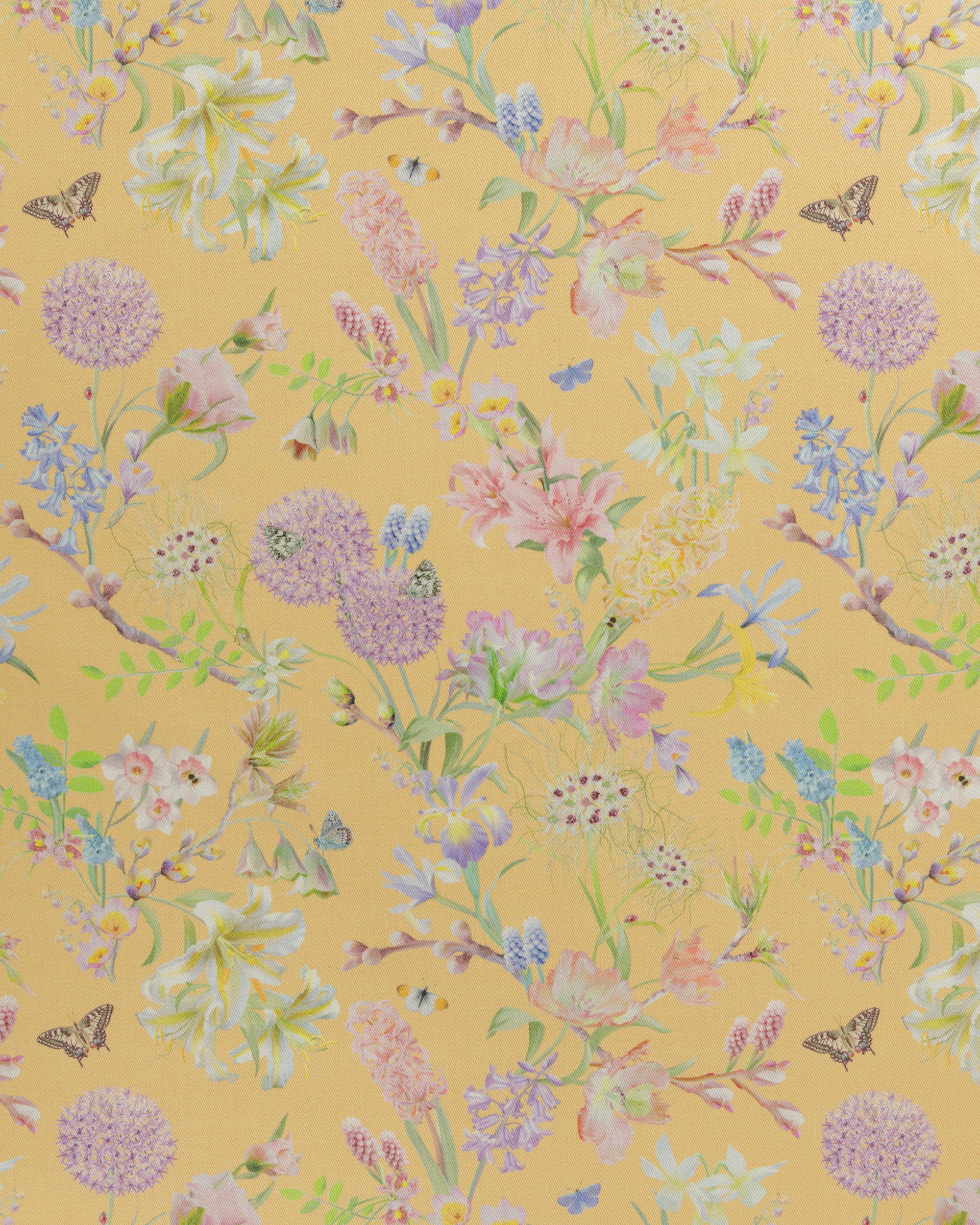 Hopeful Beginnings fabric in yellow featuring hand drawn English garden flowers including daffodils, Lillies and bluebells on a soft lemon background.