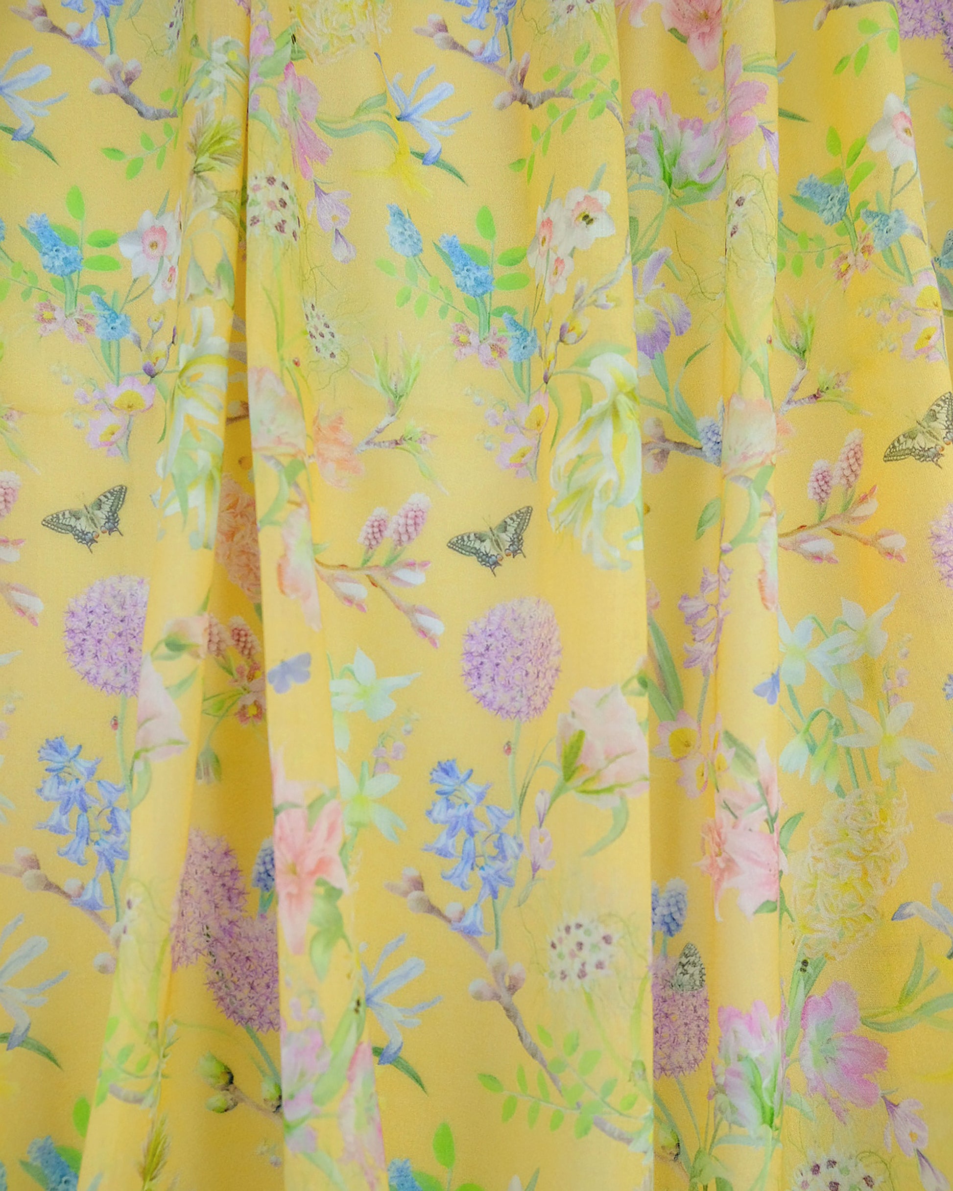 Ethical organic cotton voile fabric for net curtains in a hand drawn light lemon yellow pattern for luxury interiors