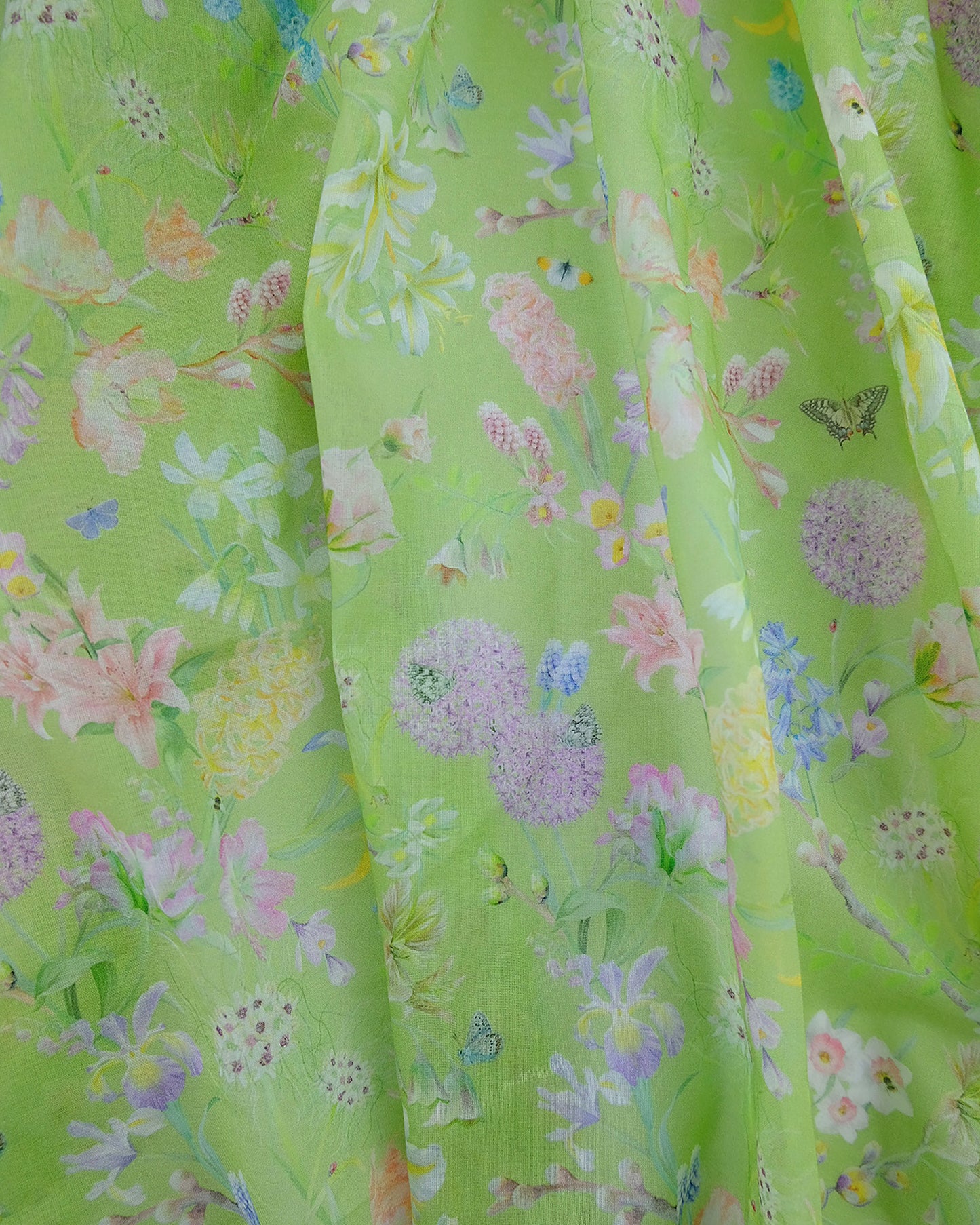 Lightweight sustainable drapery in a spring flowered ‘optimism renewed’ green for curtains and voile furnishings.