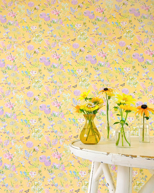 Light yellow designer wall covering with a hand illustrated nature inspired design for modern home decor