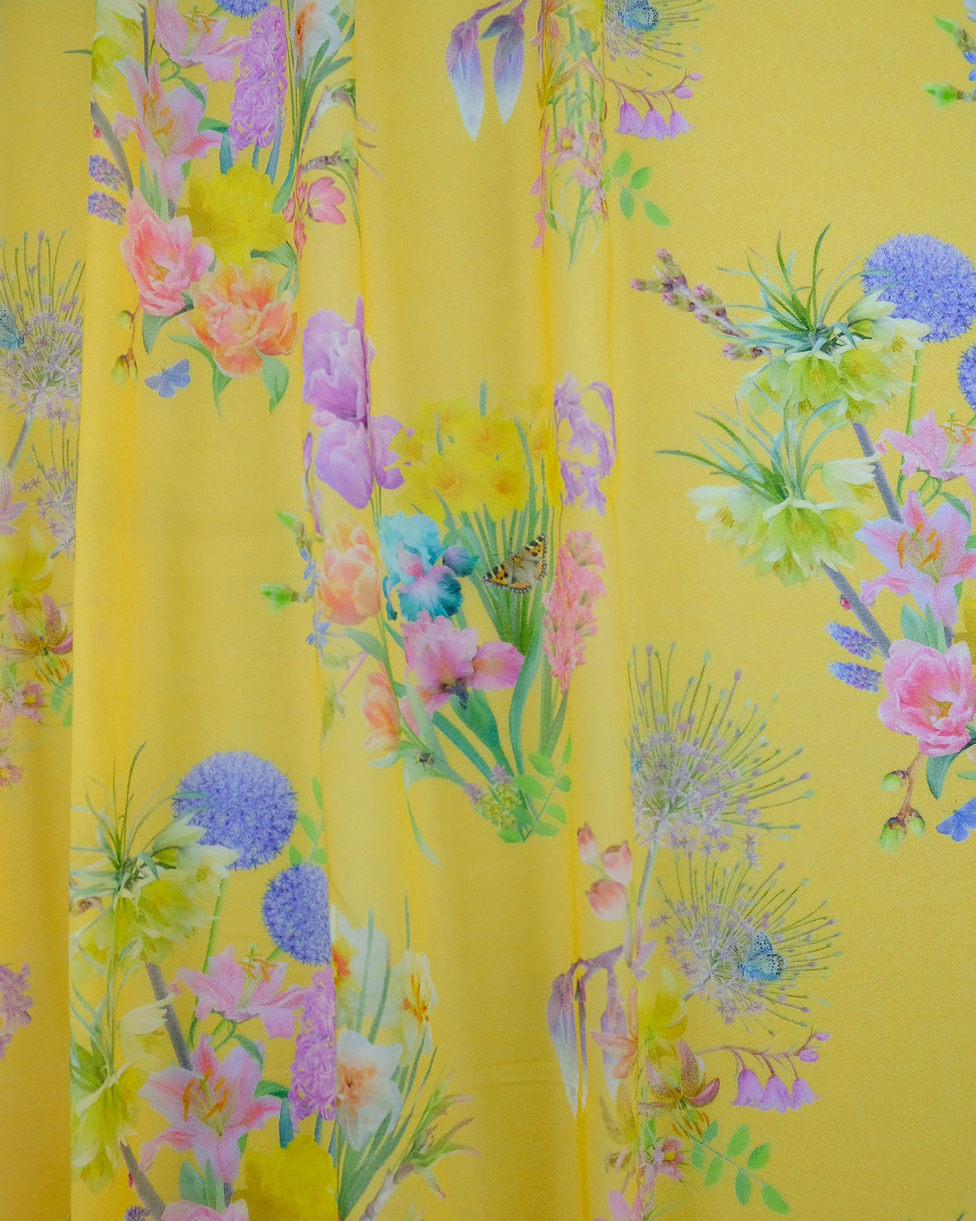 Ethical organic cotton voile fabric for net curtains in a hand drawn bright lemon yellow pattern for luxury interiors.