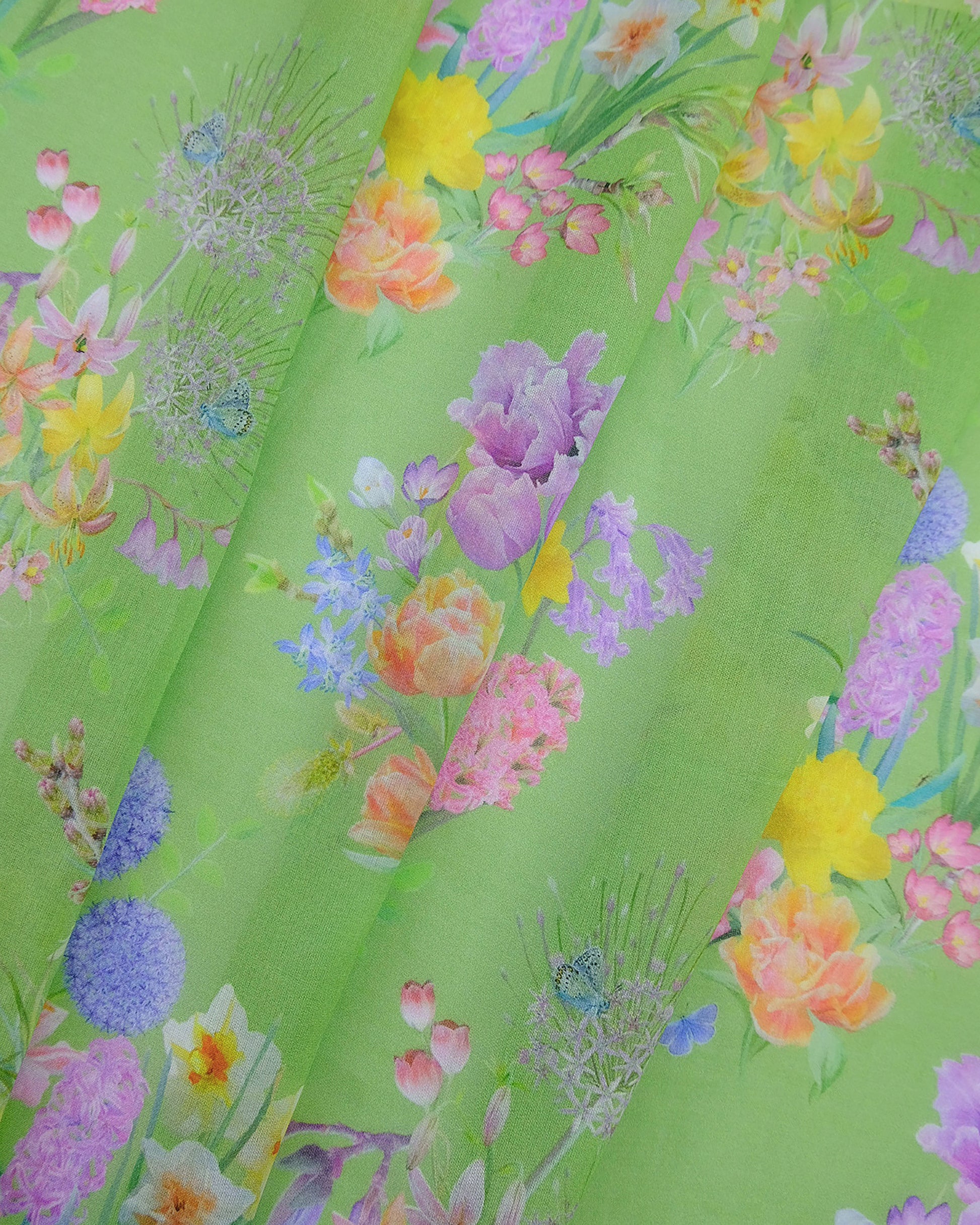 Lightweight sustainable drapery in a spring flowered ‘optimism renewed’ green for curtains and voile furnishings.