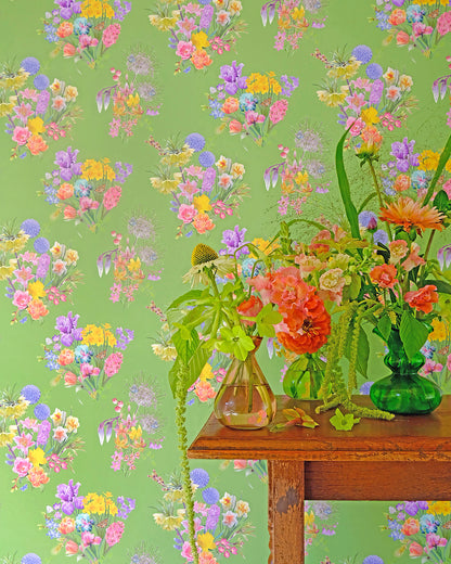 Colourful luxury wallpaper in bright green with a spring floral pattern for traditional cottage interiors
