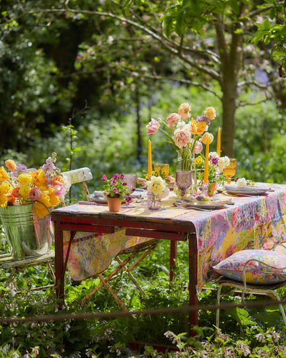 A summer inspired al fresco dining with floral patterned organic cotton fabric tablecloth, napkins and cushions.
