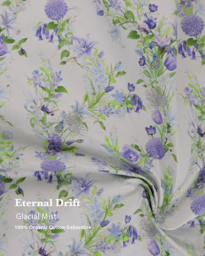 Eternal Drift Glacial Mist blue gabardine fabric in 100% organic cotton, shown draped as curtains with soft flowing movement and natural weave.