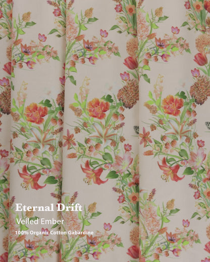 Eternal Drift Veiled Ember orange gabardine fabric in 100% organic cotton, shown draped as curtains with soft flowing movement and natural weave.