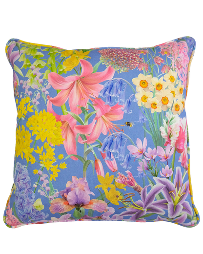 Bright blue spring floral designer piped cushion for maximal interiors in organic sustainable fabrics